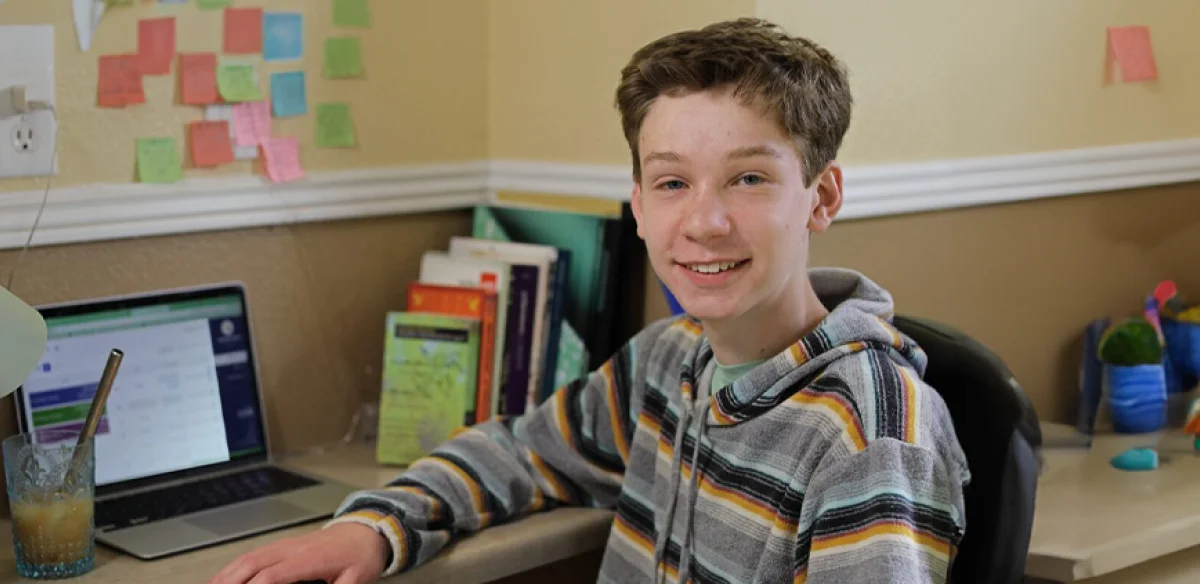 Student attending to an online class at home